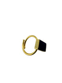 Black onyx rectangle ring with 18K gold plated brass bezel setting displayed in a black velvet jewelry box, top view.