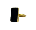 Black onyx rectangle ring with 18K gold plated brass bezel setting displayed in a black velvet jewelry box, top view.