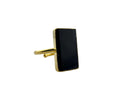 Black onyx rectangle ring with 18K gold plated brass bezel setting displayed in a black velvet jewelry box, top view.