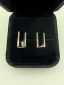 Black Onyx Stud Earrings featuring polished black onyx stone in a gold-tone rectangular setting.