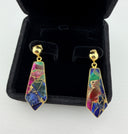 Mohave multi copper turquoise drop earrings in a black velvet jewelry box, highlighting the rich jewel-toned composite stone in gold bezel setting.