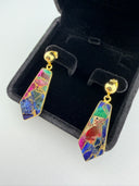 Mohave multi copper turquoise drop earrings in a black velvet jewelry box, highlighting the rich jewel-toned composite stone in gold bezel setting.