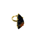orange and black Mojave copper turquoise ring showing the dramatic triangular freeform stone in a gold plated brass prong setting with adjustable band