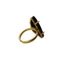 orange and black Mojave copper turquoise ring showing the dramatic triangular freeform stone in a gold plated brass prong setting with adjustable band