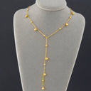 Onyx Celeste Beaded Lariat Necklace displayed on a jewellery stand