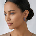 Model wearing Onyx Cobalt Prism Hoop Earrings