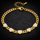 Onyx Crystal Heart Chain Bracelet in gold with cubic zirconia heart details on dark background