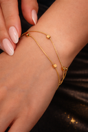 Onyx Double Snake Chain Bracelet in gold with two fine chains and bead accents on dark background