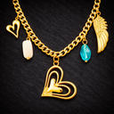 Onyx Multi Charm Necklace in gold with layered chain and mixed charms including heart, crystal and wing details on dark background