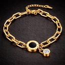 Onyx Roman Link Bracelet in gold with black dial detail, Roman numerals and crystal accent on dark background