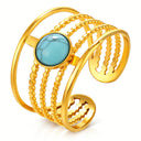 PVD gold-plated adjustable stainless steel statement ring with turquoise-effect centre