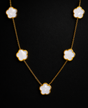 gold necklace with white clover details 